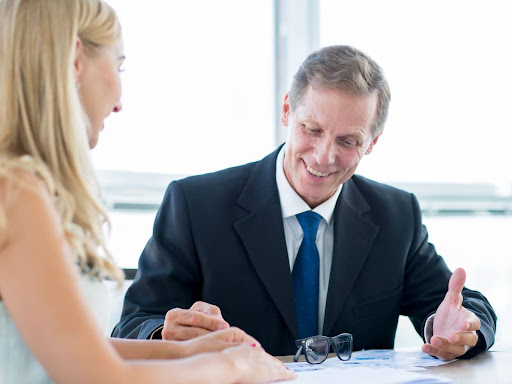 Personal injury lawyer, consulting with a client about a car accident case in Elms-Old Rexdale