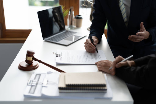 Personal injury lawyer, consulting with a client about a car accident case